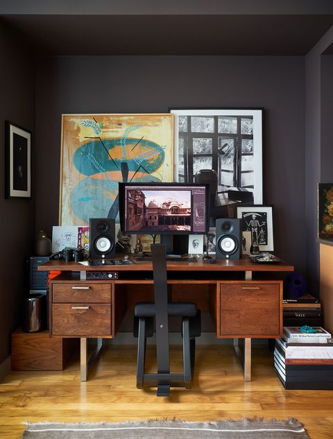 home office with monitor, speakers, and modern chair