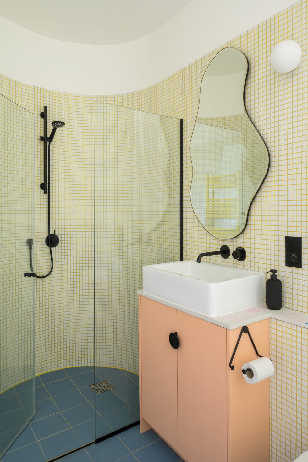 a bathroom with a mirror and sink modern hackney