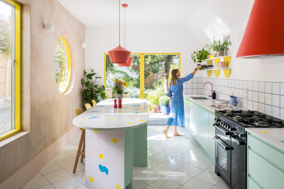 a person in a kitchen modern colourful london