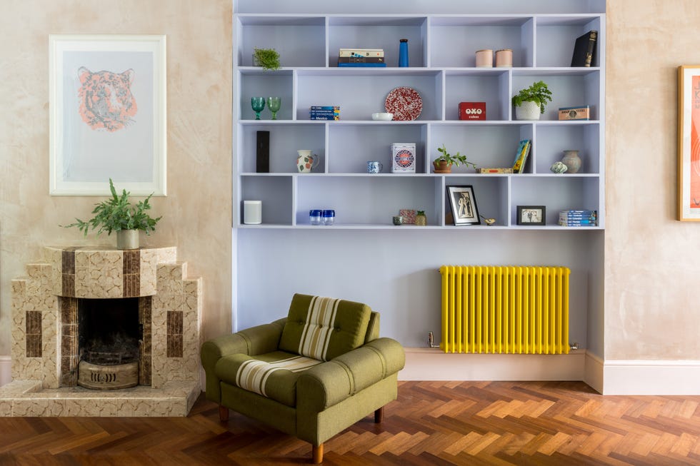 a living room with a fireplace lilac wall herringbone wood floor plaster wall art deco fireplace contemporary style edwardian hackney home