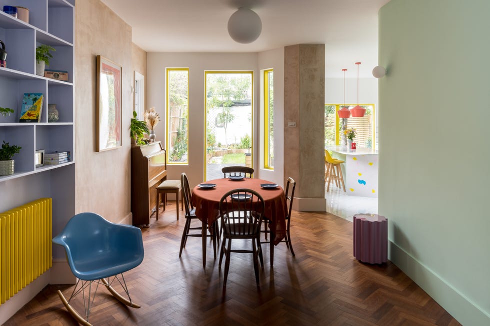 a dining room with a table and chairs