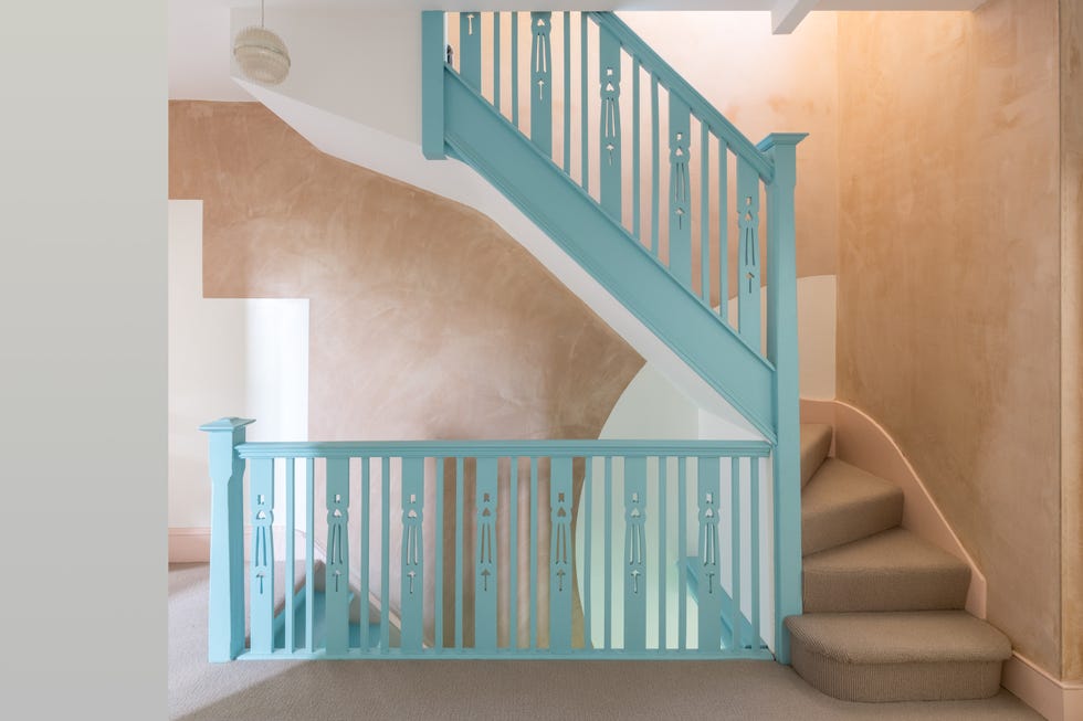 a staircase with a blue railing