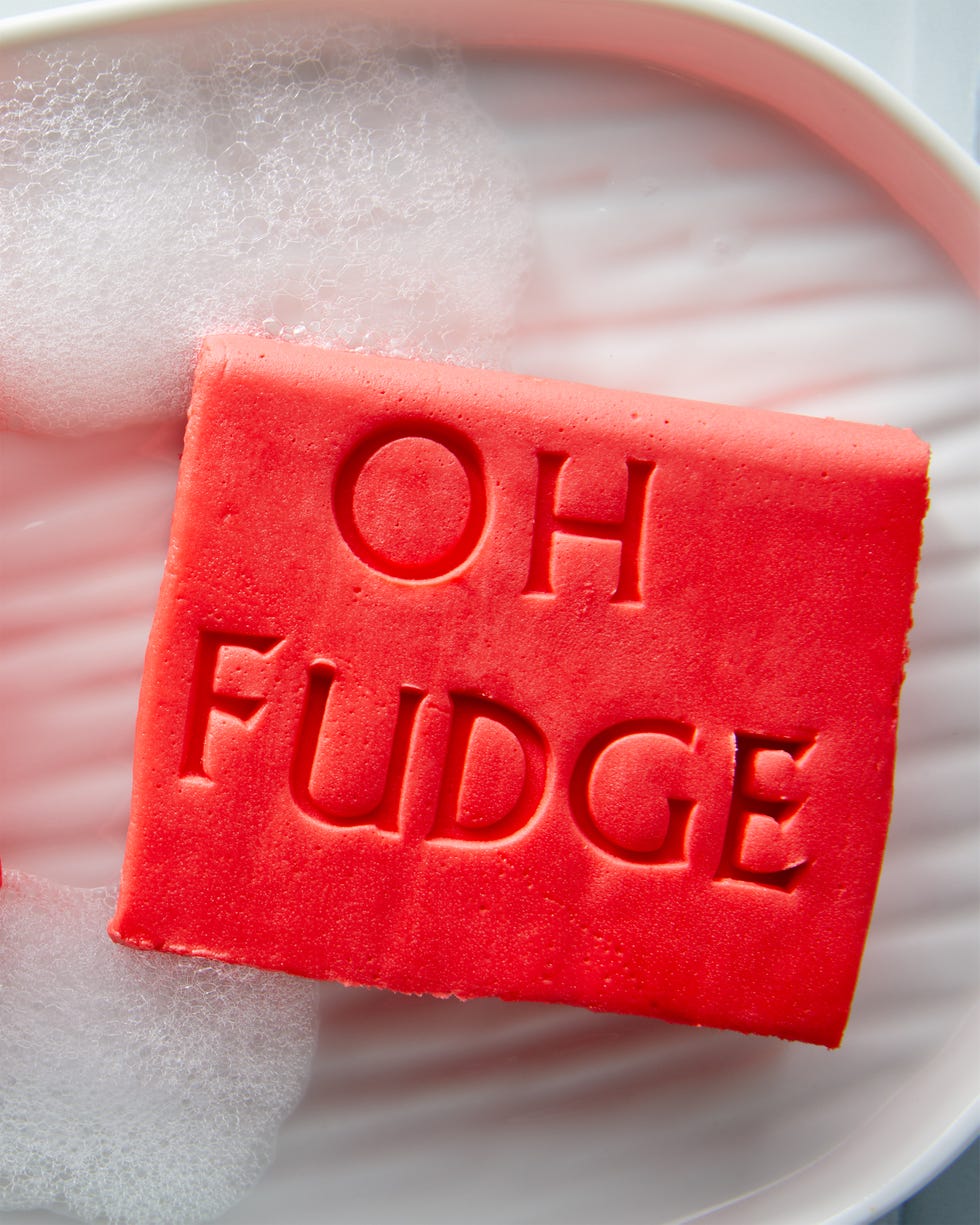 red fudge shaped like soap with the words oh fudge