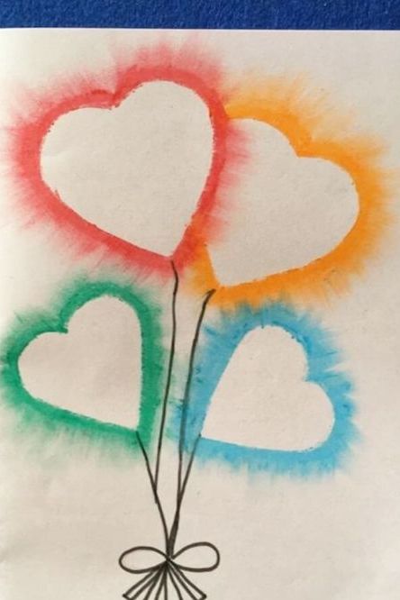 oil pastel valentine's day card idea with heart balloon designs outlined with red, orange, blue and green