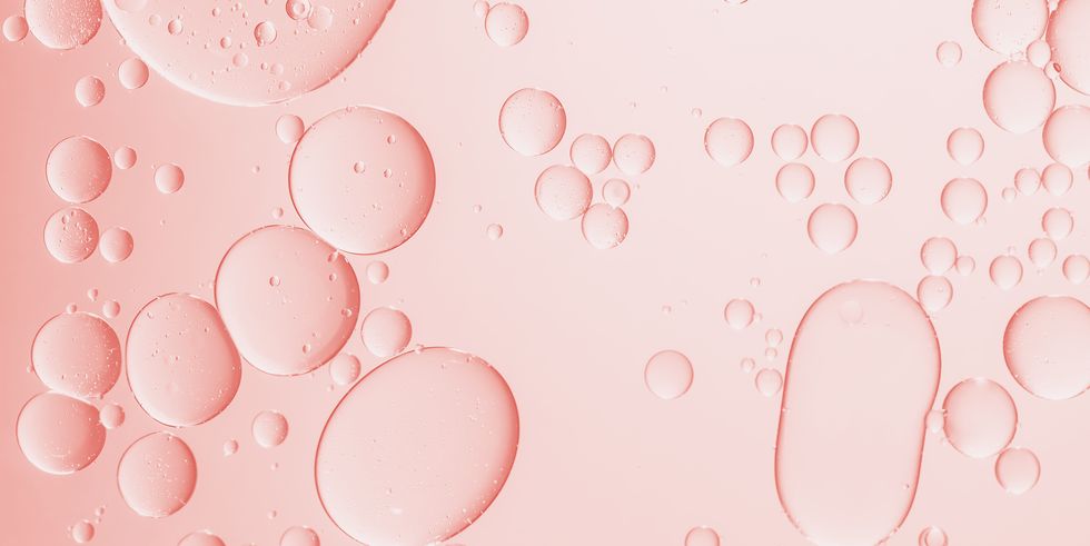 oil with bubbles on pink monochrome background