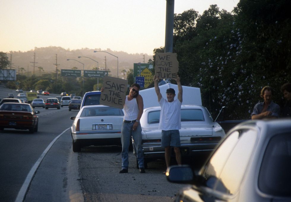 Fans on the side of the street cheering O.J. Simpson on during the Bronco chase