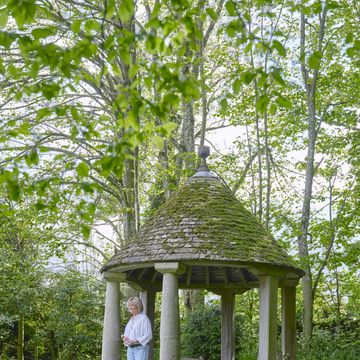 cotswolds home of oka cofounder sue jones a stone tiled gazebo provides shelter from the sun and a cozy place to sit in the evenings