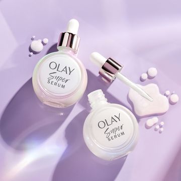 a close up of bottles of olay super serum