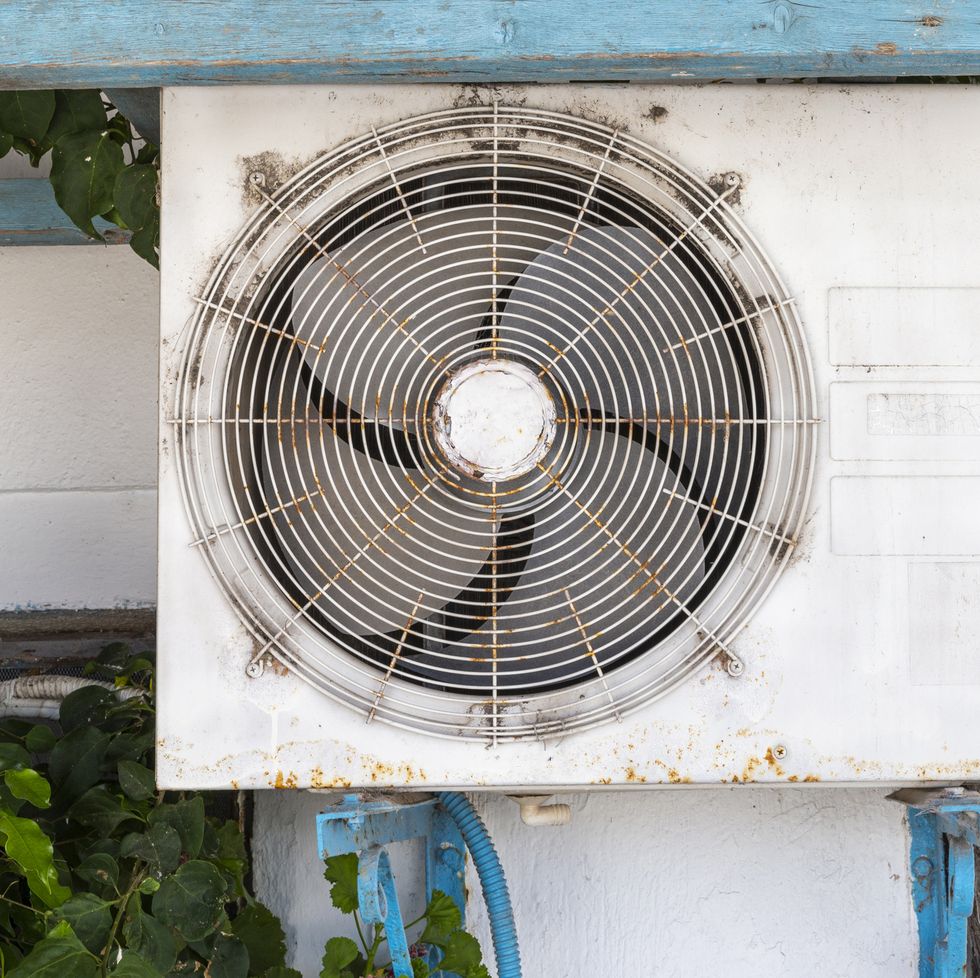 old air conditioner on building wall