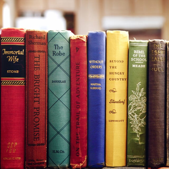 Old Books Arranged On Shelf