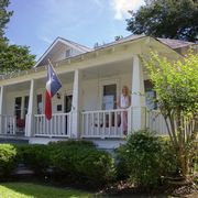 old historical home in southern usa front porch woman texas