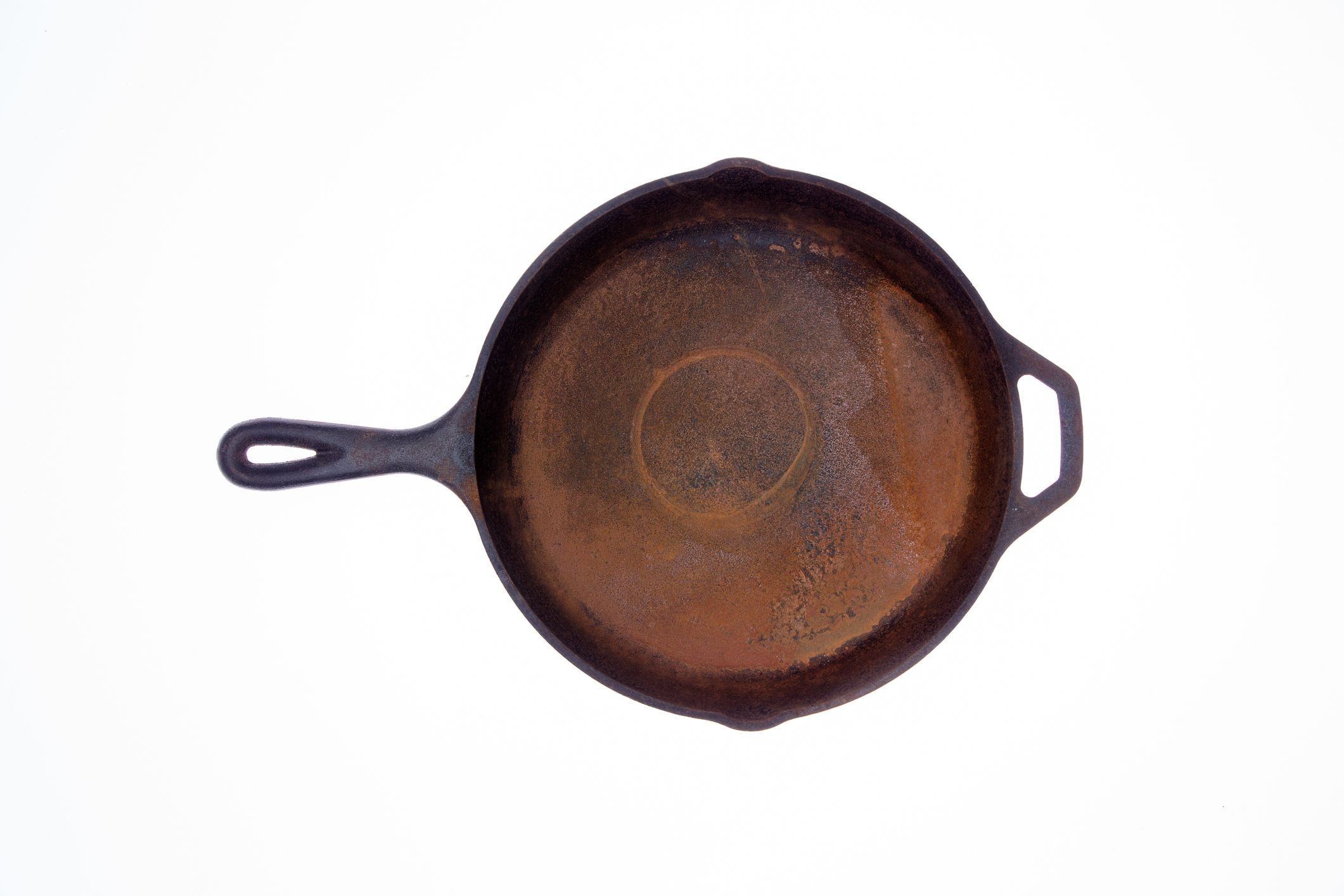https://hips.hearstapps.com/hmg-prod/images/old-rusty-round-cast-iron-frying-pan-royalty-free-image-1684529860.jpg