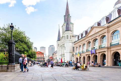 old town chartres street in louisiana famous city with many people crowd on jackson square and church