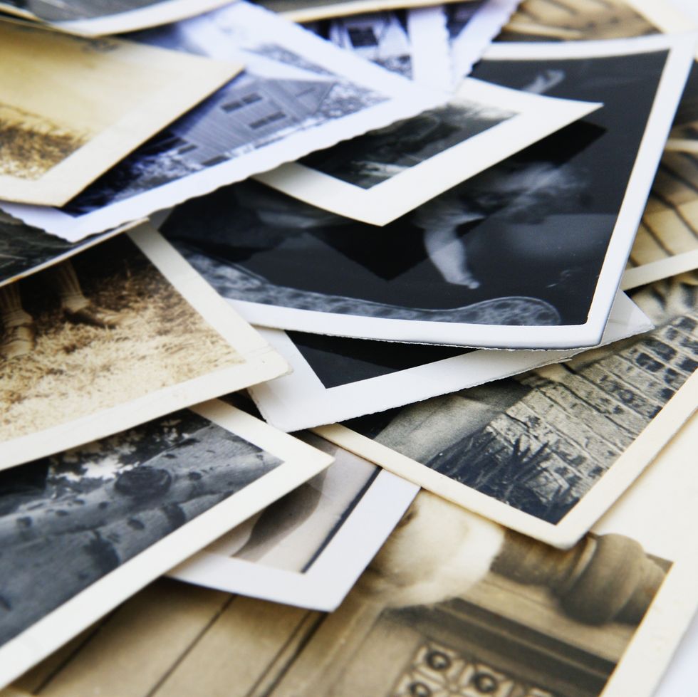 old vintage retro candid photographs in a pile