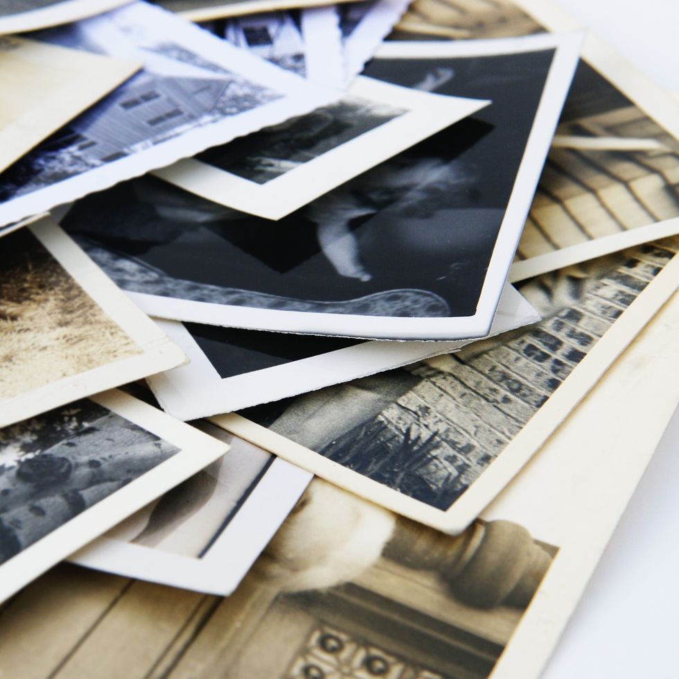 old vintage retro candid photographs in a pile