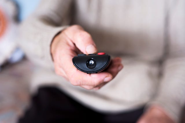 old woman using a remote control