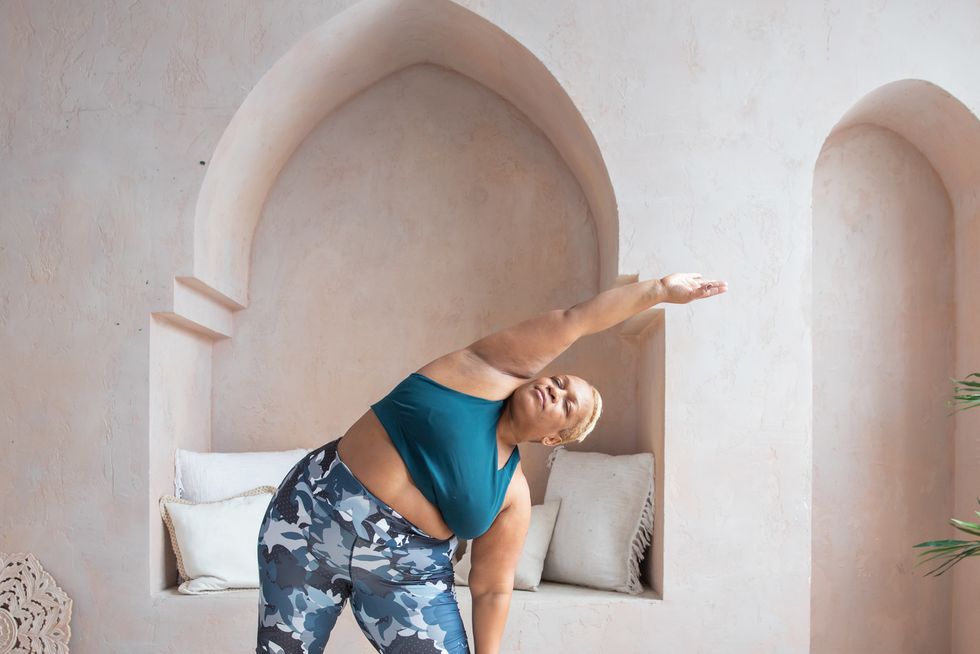 older black woman doing yoga