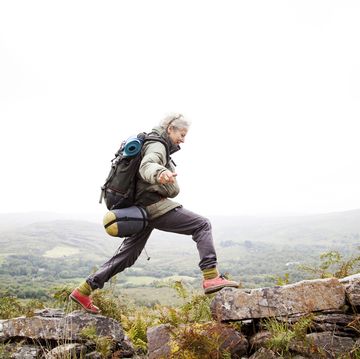 older woman trekking in the mountains of ireland