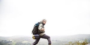 older woman trekking in the mountains of ireland