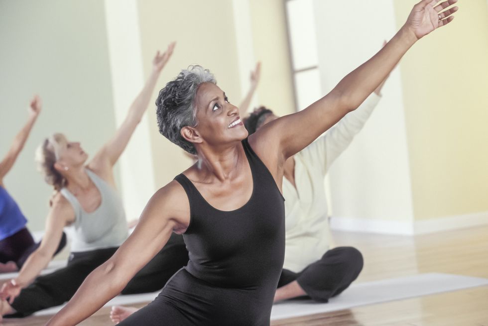 older women stretching in yoga class