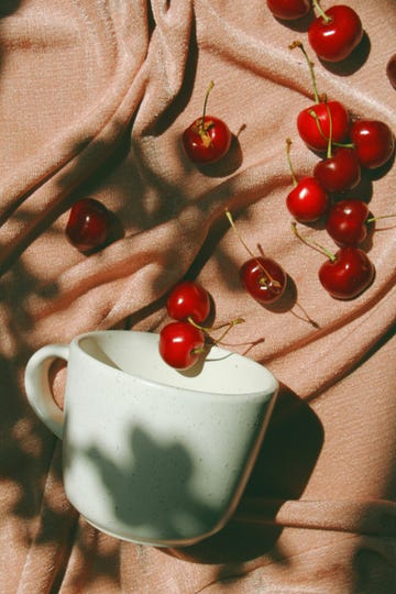 a cup of tea with cherry tomatoes