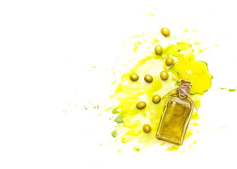 Olive oil and green olives shot from above. Creative food shot with watercolor.