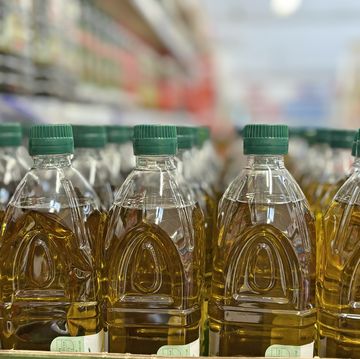 olive oil bottles on rack at store