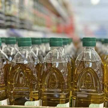 olive oil bottles on rack at store