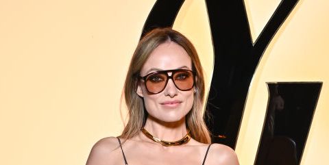 Olivia Wilde spices up her simple outfit by wearing a black bra under her  sheer white T-shirt