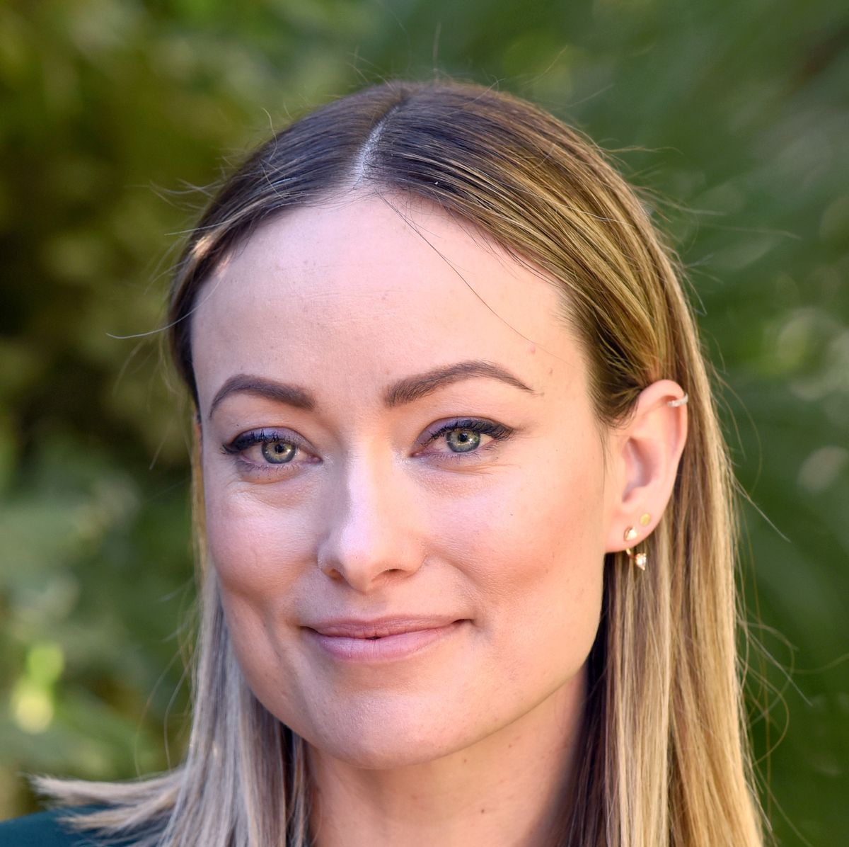 Olivia Wilde smiles as she showcases her toned abs in a green crop-top and  leggings following her daily workout in Los Angeles