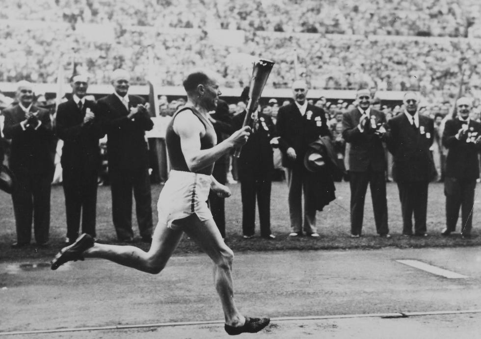 olympic games helsinki 1952 paavo nurmi with the olympic torch
