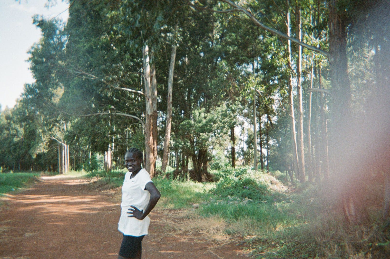 a man walking on a dirt road