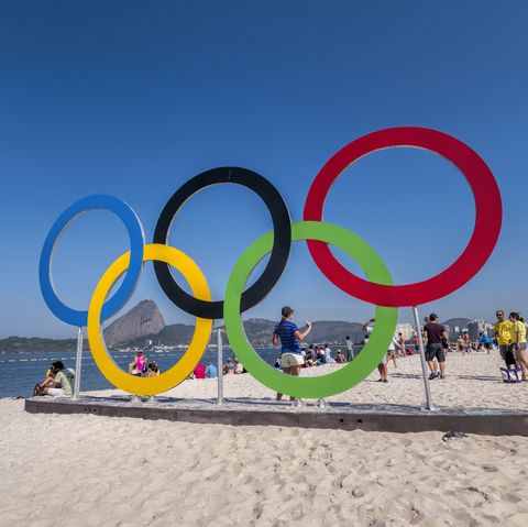 the olympic rings at flamengo beach where the sailing events are taking place sugar loaf in the background