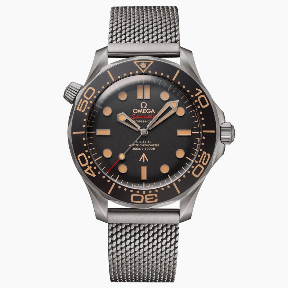 diving watch with a black dial and mesh strap