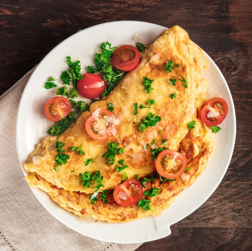 omelet with parsley, cherry tomatoes, and copyspace