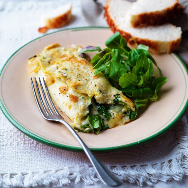 served omelette with a side of greens