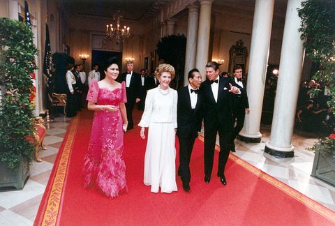 On a ceremonial occasion, President Ronald Reagan and First Lady Nancy Reagan play host to Philippine President Ferdinan
