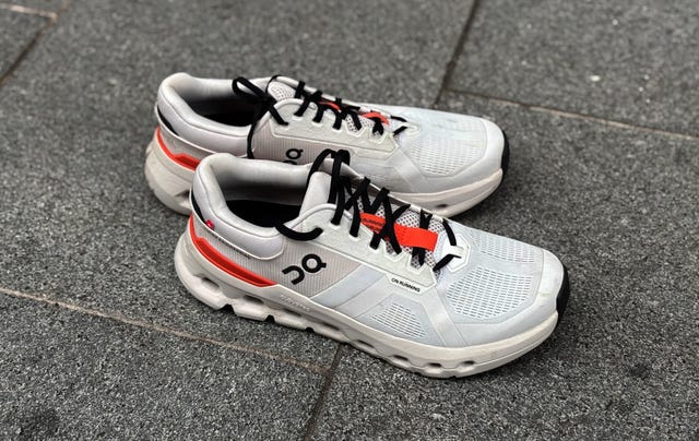 pair of running shoes on a pavement