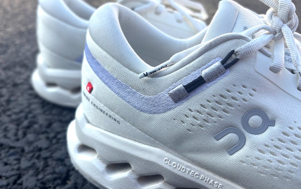 close up of the heel of a white running shoe from on