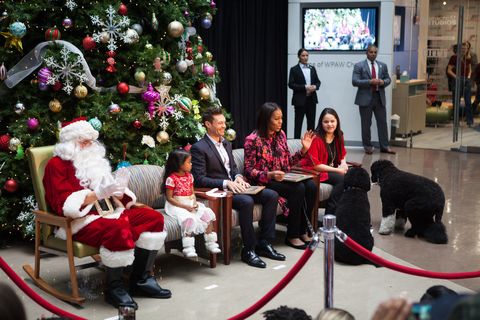 First Lady Michelle Obama and Ryan Seacrest spread holiday cheer to Childrens National patients and families