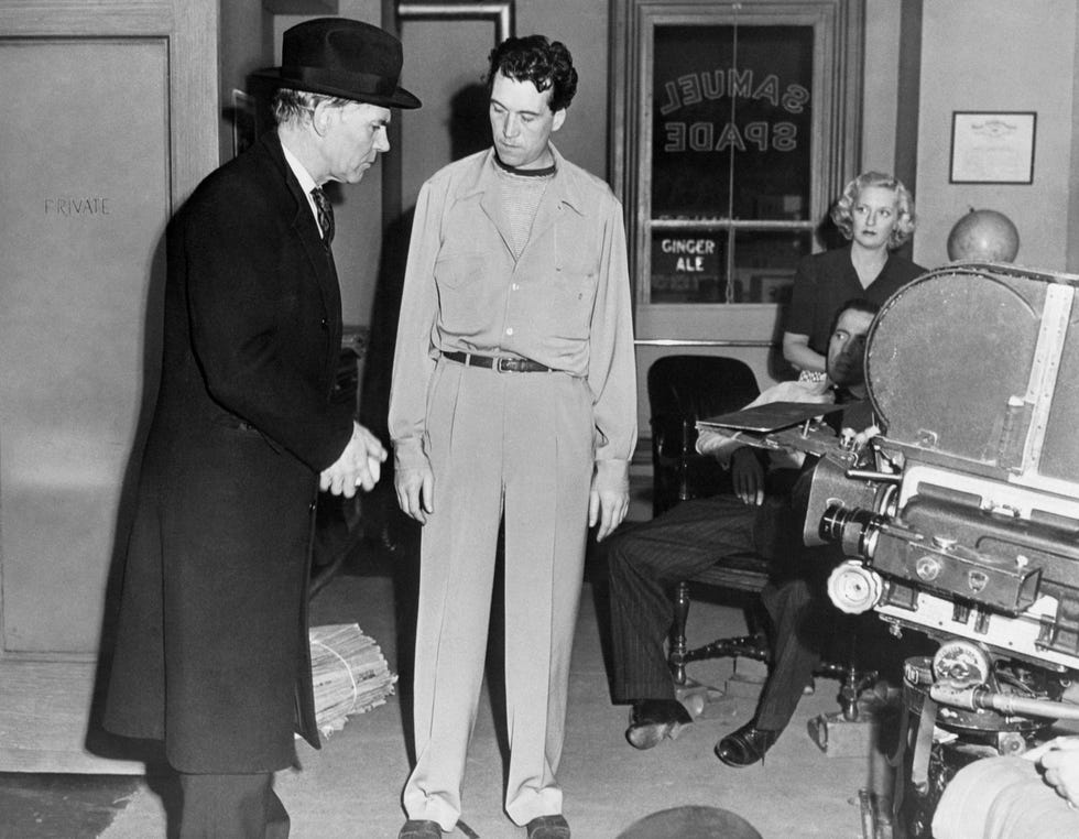 walter and john huston on maltese falcon set