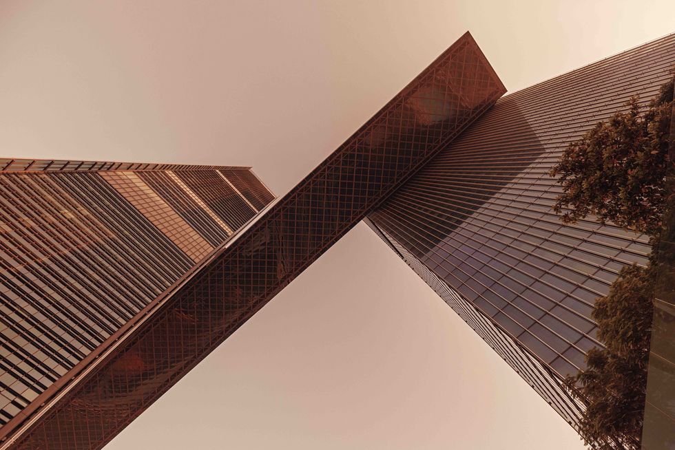 a worms eye view of one za abeel, looking up at the cantilever that connects the two towers
