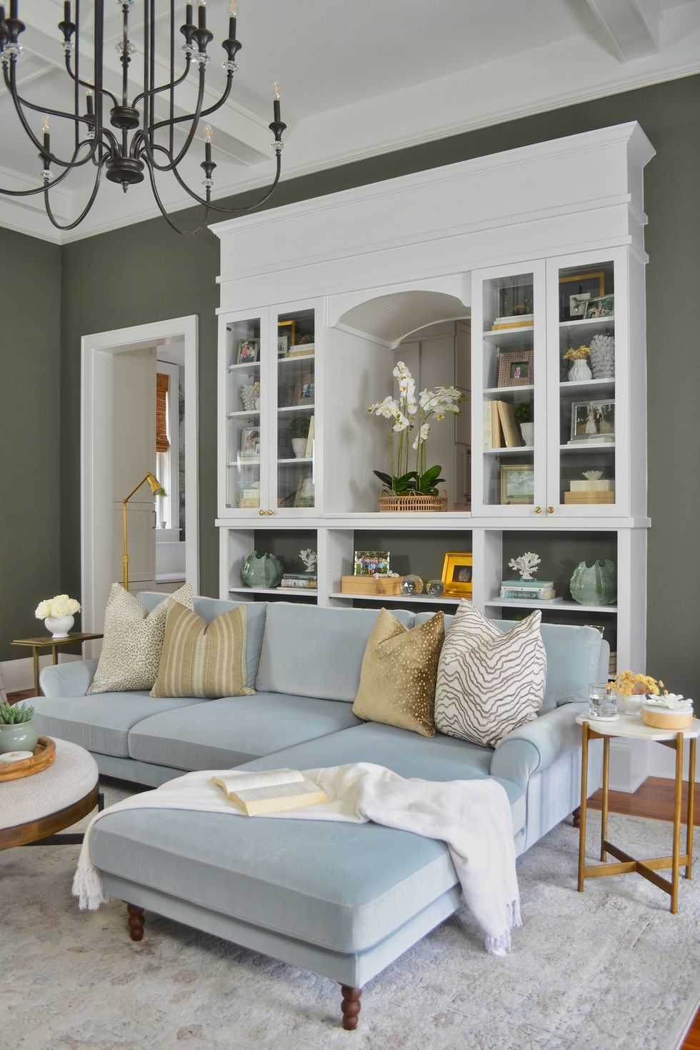 green living room with pale blue couch