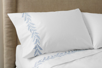 bedding with blue embroidery