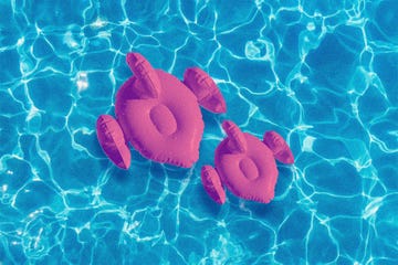 large and small flamingo pool float in water