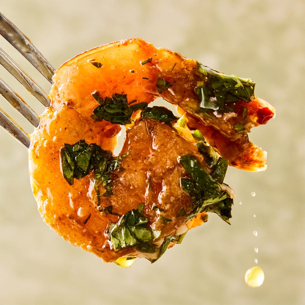 for this under 30 minute one pan dinner, cumin and coriander marinated shrimp are cooked with shallots, topped with a parsley, cilantro, and oregano based chimichurri sauce, and served with crusty bread