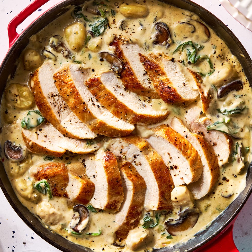 gnocchi and chicken breasts in a creamy sauce in a pan