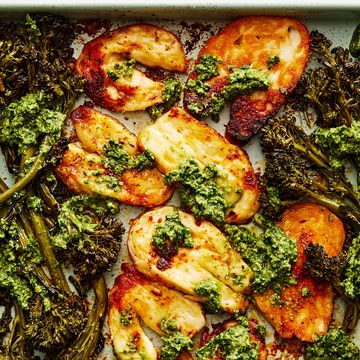 roasted halloumi and broccolini with a pesto sauce on a sheet pan