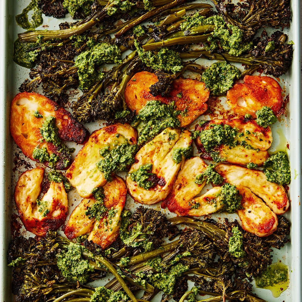 roasted halloumi and broccolini with a pesto sauce on a sheet pan
