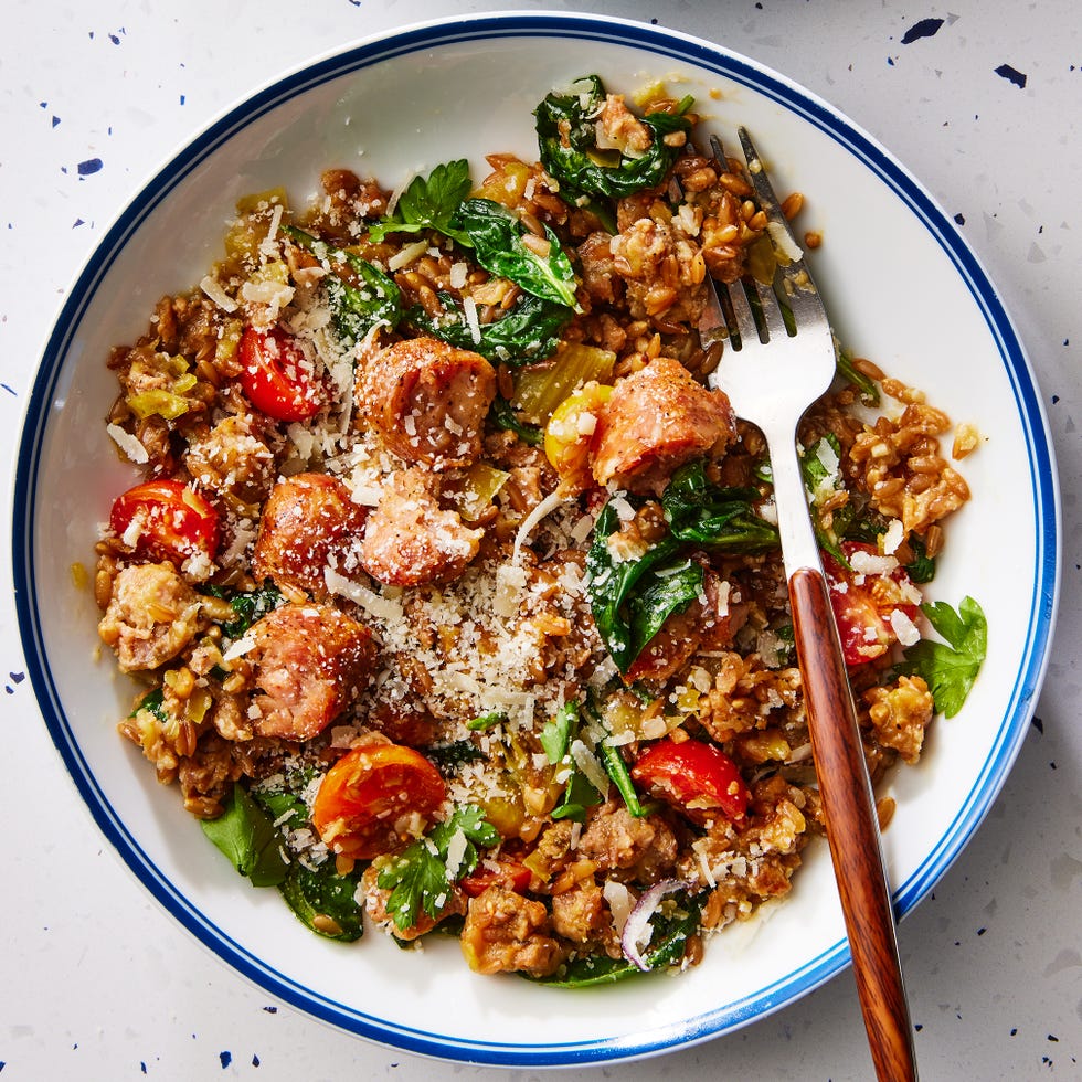 one pot farro with chicken sausage and tomatoes topped with fresh herbs